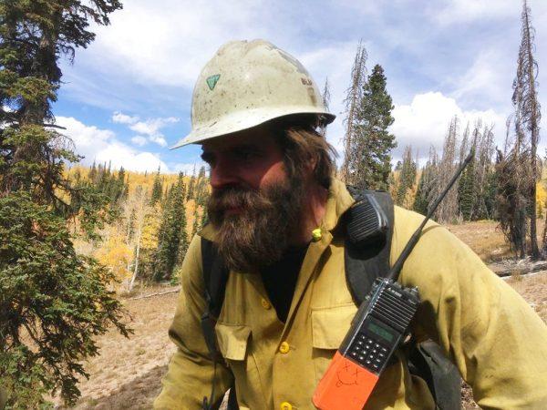 In this 2018 photo provided by Christopher Schott, Schott works in Utah with a firefighting crew out of Lakeview, Ore. After being in firefights in Afghanistan and Iraq, members of the new elite crew from Lakeview are bringing their military experience to bear as they battle wildfires in the most rugged country back home. The Lakeview Crew 7 is comprised almost entirely of U.S. military veterans like Schott. (Courtesy of Christopher Schott via AP)