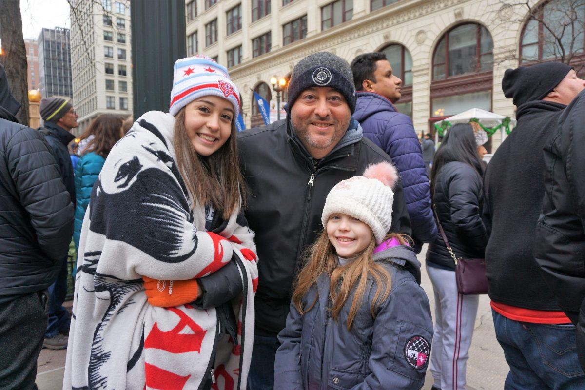 Luis Amaya and his daughters at the Thanksgiving Day Parade in Chicago. (Catherine Wen)