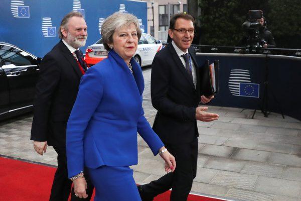 Britain's Prime Minister Theresa May arrives with Britain's Permanent Representative to the EU Tim Barrow at an extraordinary EU leaders summit to finalize the Brexit agreement in Brussels, Belgium, on Nov. 25, 2018. (Yves Herman/Pool/Reuters)