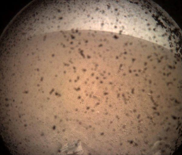 NASA's InSight Mars lander acquired this image of the area in front of the lander using its lander-mounted, Instrument Context Camera (ICC) with the ICC image field of view of 124 x 124 degrees, on Mars, on Nov. 26, 2018. (NASA/JPL-Caltech/Handout via Reuters)