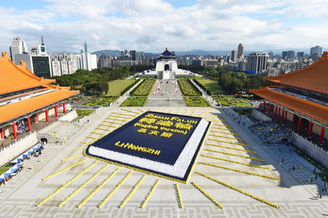 Thousands From Around the World Gather in Taipei to Form Image of Book That Guides Their Spirituality