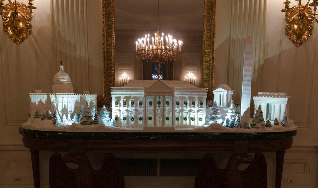 The gingerbread house, showcasing the full expanse of the National Mall: the Capitol, the Lincoln Memorial, the Jefferson Memorial, the Washington Monument, and, the White House is seen in the State Dining Room during the 2018 Christmas Press Preview at the White House in Washington, on Nov. 26, 2018. (AP Photo/Carolyn Kaster)