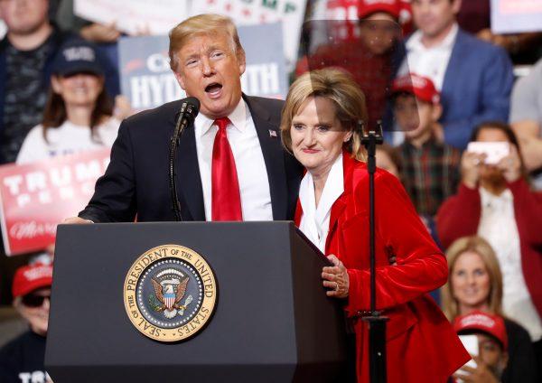 President Donald Trump and Sen. Cindy Hyde-Smith (R-Miss.) speak at a runoff campaign rally in Biloxi, Mississippi, on Nov. 26, 2018. (Kevin Lamarque/Reuters)