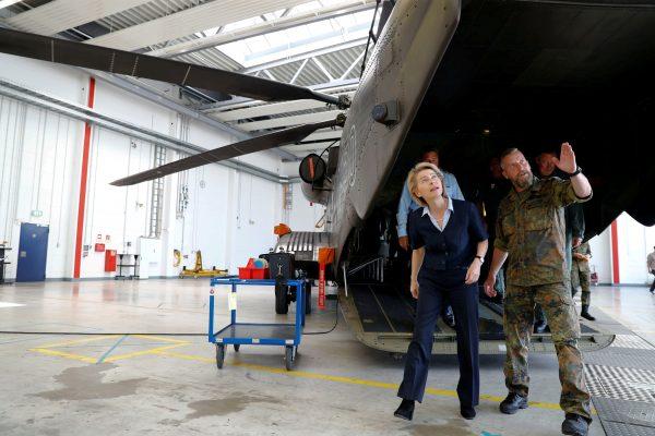  German Defense Minister Ursula von der Leyen next to a German Bundeswehr armed forces Sikorsky CH-53 helicopter during a visit to Holzdorf Air Base, south of Berlin, Germany, on July 24, 2018. (Reuters/Fabrizio Bensch/File Photo)
