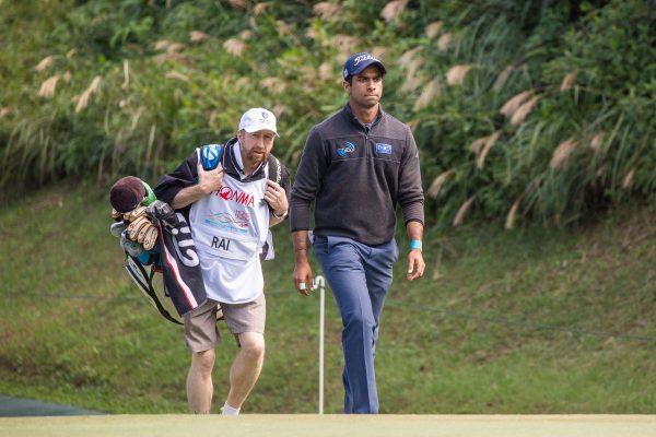 Aaron Rai and caddie on course for victory after a stunning course record of 61, in the second round of the HK Open on Friday Nov 23. Rai kept his cool to stay ahead of his key challenger Matthew Fitzpatrick with a 17 under par total of 263 strokes. (Dan Marchant)
