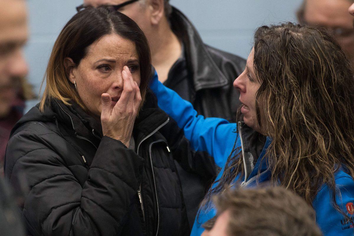 A Unifor union member cries before the press conference with union leaders in Oshawa, Ontario, on Nov. 26, 2018. (Lars Hagberg/AFP/Getty Images)