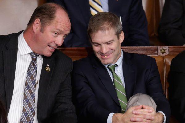 Rep. Ted Yoho (R-FL) (L) talks with Rep. Jim Jordan in the House of Representatives chamber at the U.S. Capitol in Washington, DC on October 29, 2015. (Chip Somodevilla/Getty Images)