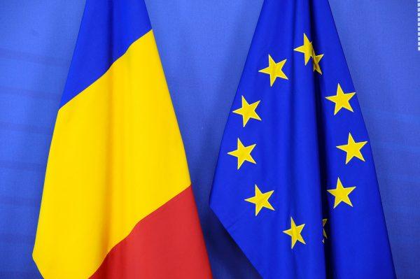 Romanian and EU flags at the European Commission headquarters in Brussels in this file photo. (Thierry Charlier/AFP/Getty Images)