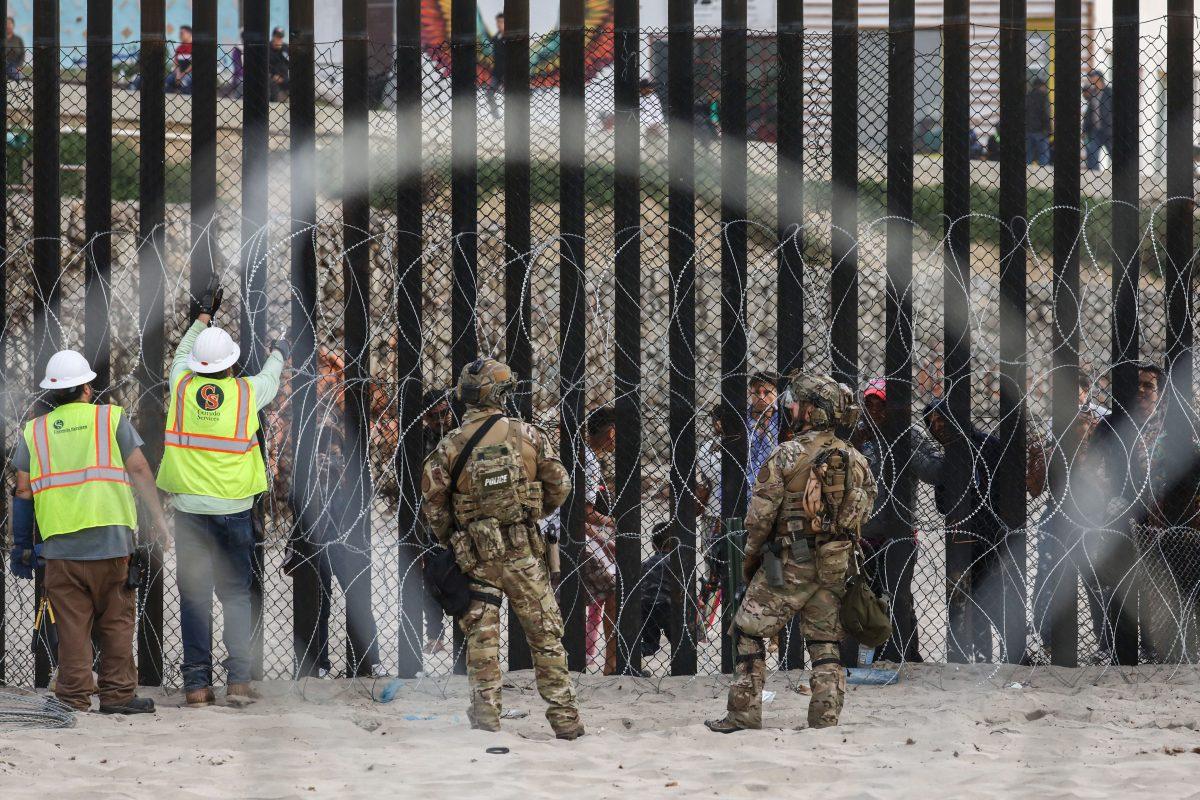 The U.S. military patrols the U.S.-Mexico border fence at Friendship Park in San Ysidro, Calif., on Nov. 15, 2018. (Charlotte Cuthbertson/The Epoch Times)