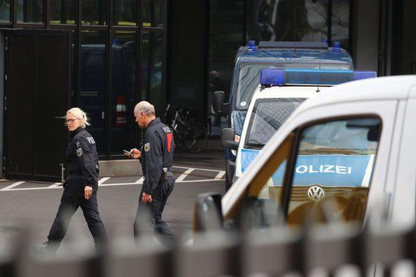 Police walk in front of Deutsche Bank headquarters in Frankfurt, Germany, on Nov. 29, 2018. (Reuters/Kai Pfaffenbach)