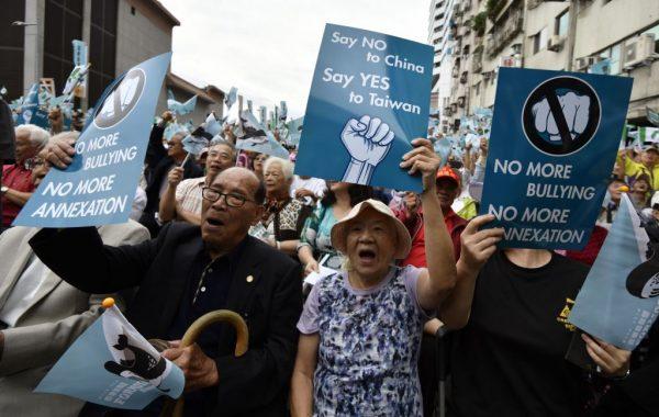 Pro-Taiwan independence activists displaying placards calling for a referendum during a rally in Taipei, on Oct. 20, 2018. (Sam Yeh/AFP/Getty Images)