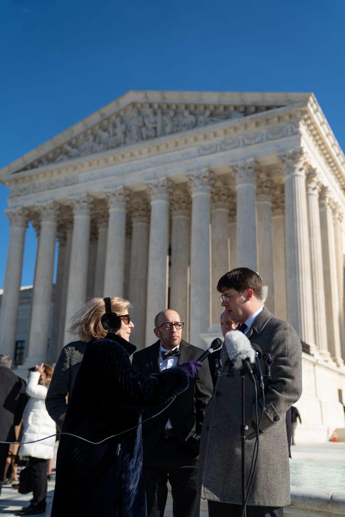 Tyson Timbs (C) and senior Institute of Justice attorney Wesley Hottot (R) hold a press conference on the steps of the Supreme Court in Washinton on Nov. 28, 2018. (Institute of Justice)