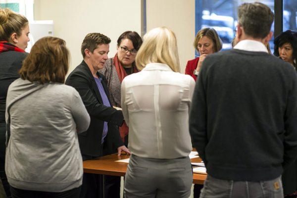 Alaska Assistant Attorney General Margaret Paton-Walsh, third from left, and Josie Bahnke, Director of Elections, center, explain their decision on questioned ballots during the recount of Alaska House District 1 at the Department of Elections' Juneau office on Friday, Nov. 30, 2018. (Michael Penn/Juneau Empire via AP)