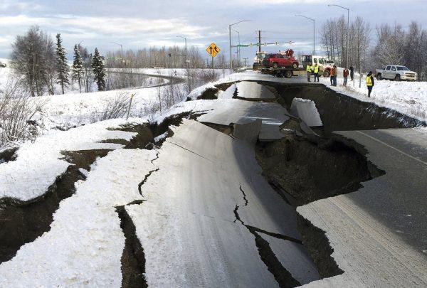A car is trapped on a collapsed section of the offramp after two earthquakes in Anchorage, Alaska, on Nov. 30, 2018. (AP Photo)