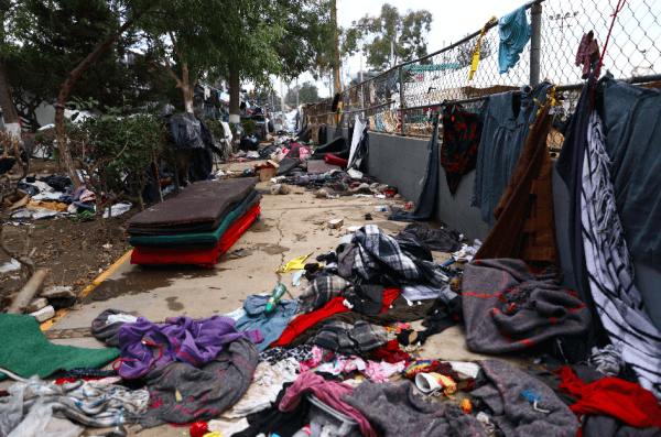  The remnants of the migrant caravan are left at the Benito Juarez sports complex near the U.S. border after almost all of them were relocated to an event space about 10 miles from the border in Tijuana, Mexico, on Dec. 1, 2018. (Charlotte Cuthbertson/The Epoch Times)