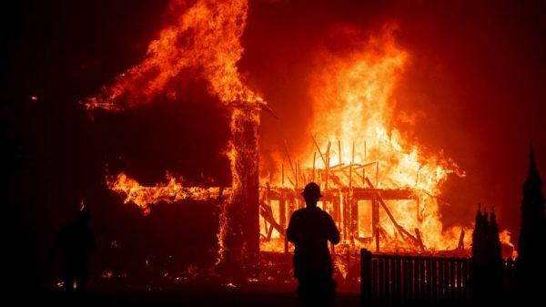 A home burns as the Camp Fire rages through Paradise, Calif., on Nov. 8, 2018. (AP/Noah Berger)