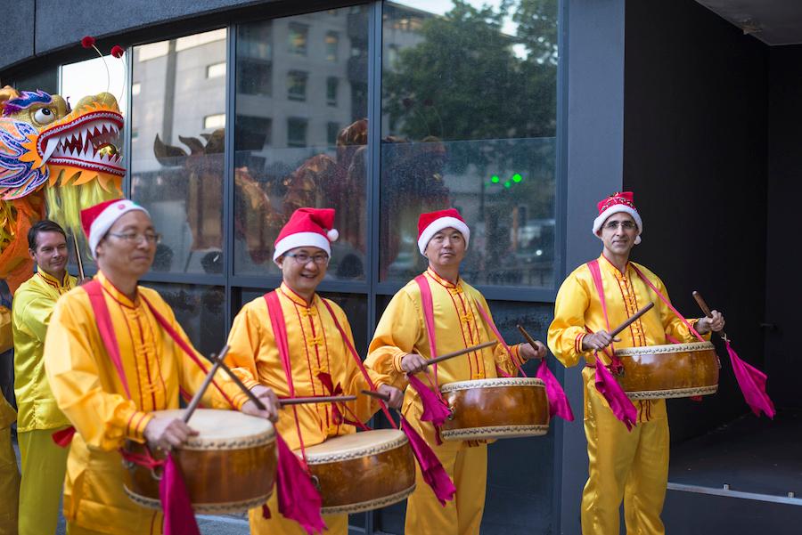 Smiling drum players from the Falun Gong community stand before the Christmas Pageant is set to take place in Perth, Australia, on Dec. 1, 2018. (Sam Lim/The Epoch Times)