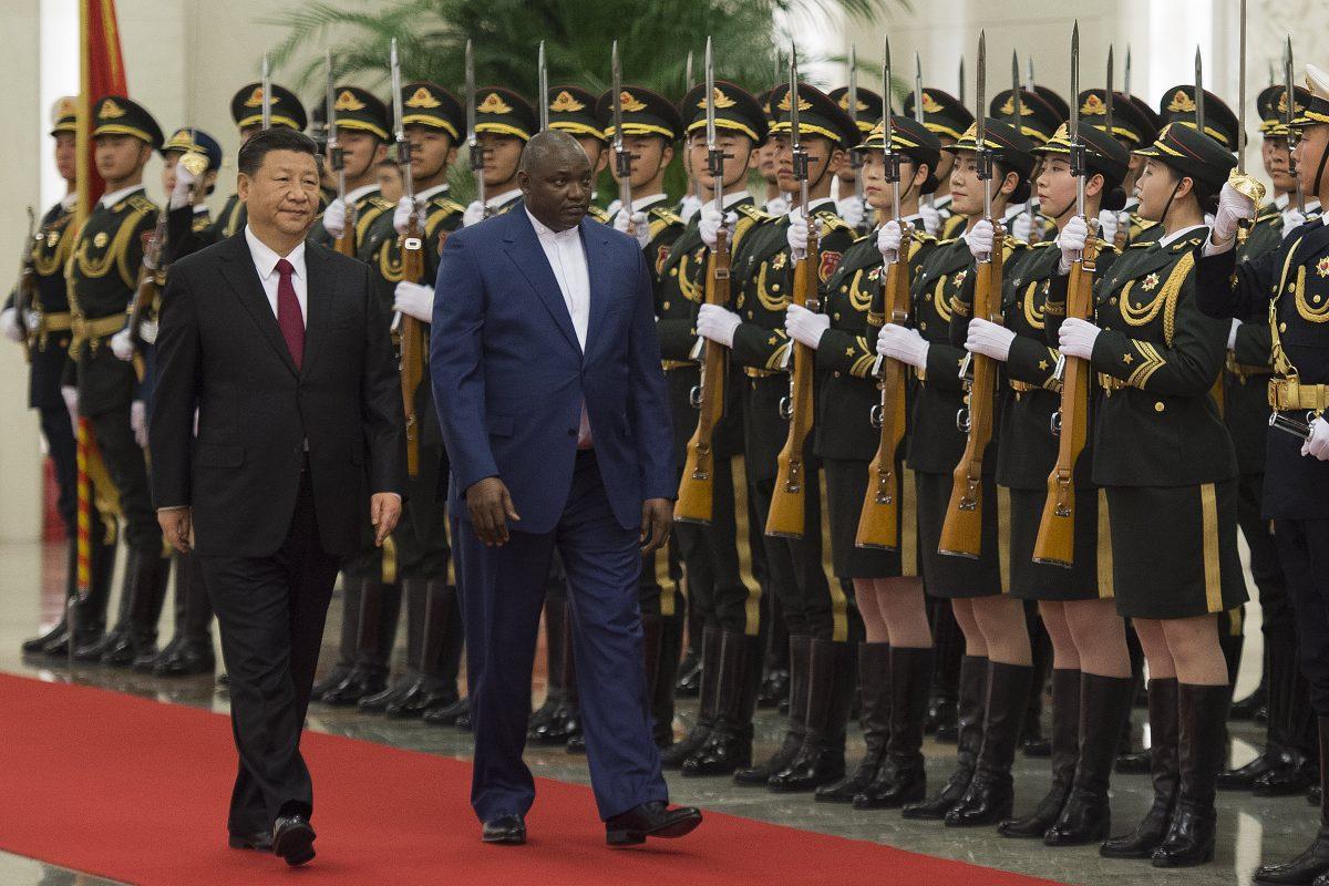 Gambia's President Adama Barrow walks with Chinese leader Xi Jinping during a welcoming ceremony at the Great Hall of the People in Beijing on Dec. 21, 2017. The two countries re-established diplomatic relations in 2016. (Nicolas Asfouri/AFP/Getty Images)