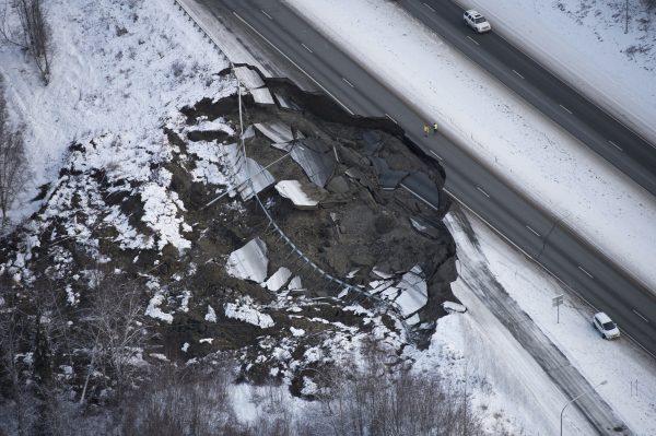 This aerial photo shows damage at the Glenn Highway near Mirror Lake after earthquakes in the Anchorage area, Alaska, on Nov. 30, 2018. (Marc Lester/Anchorage Daily News/AP)