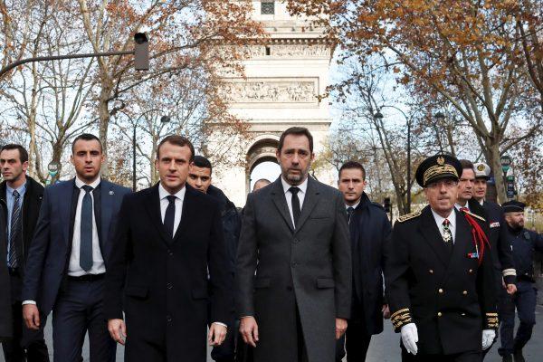 France's President Emmanuel Macron (Front L), Interior Minister Christophe Castaner (C), and Paris police Prefect Michel Delpuech (Front R) arrive to visit firefighters and riot police the day after a demonstration in Paris, on Dec. 2, 2018. (Thibault Camus/Pool via Reuters)