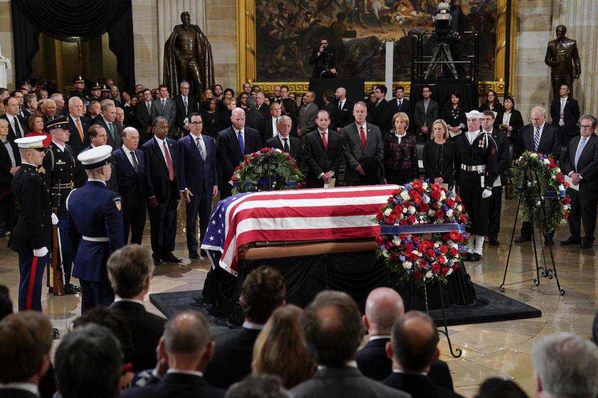 The flag-draped casket of former president George H.W. Bush lies in state at the Rotunda on Capitol Hill on Monday, December 3, 2018 in Washington, DC.(Photo by Pablo Martinez Monsivais - Pool/Getty Images)