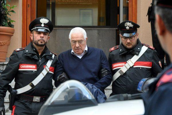 Settimino Mineo (C), jeweler and new head of the Sicilian mafia, is escorted by carabinieri as he exits a police station after his arrest, in Palermo, Italy, on Dec. 4, 2018. (Alessandro Fucarini/AFP/Getty Images)