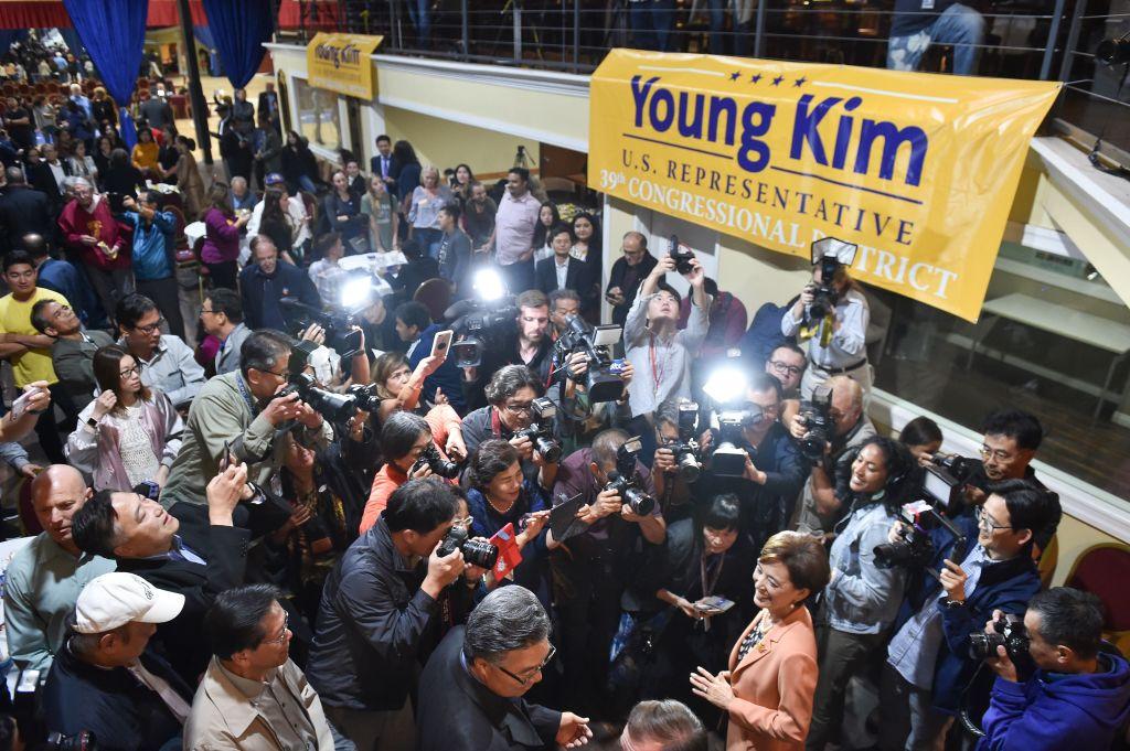 Republican Congressional candidate in California's 39th District Young Kim (R) is surrounded by supporters and media as she arrives at an election night event in Rowland Heights, Calif., on Nov. 6, 2018. (Robyn Beck/AFP/Getty Images)