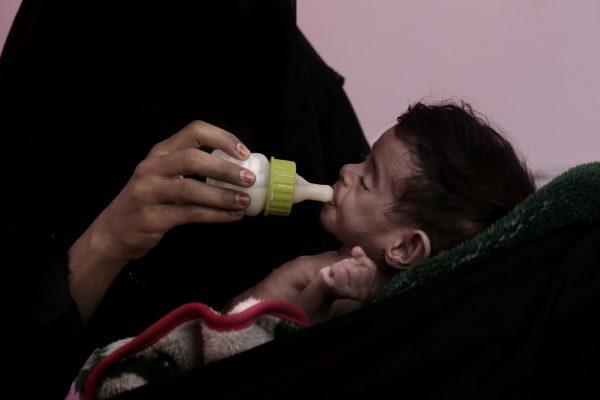 Ahmed Rashid Mokbel, a severely malnourished 7-month-old Yemeni boy, is given formula by his mother at the Al-Sadaqa Hospital in Aden, Yemen on Feb. 13, 2018. (Nariman El-Mofty/AP)