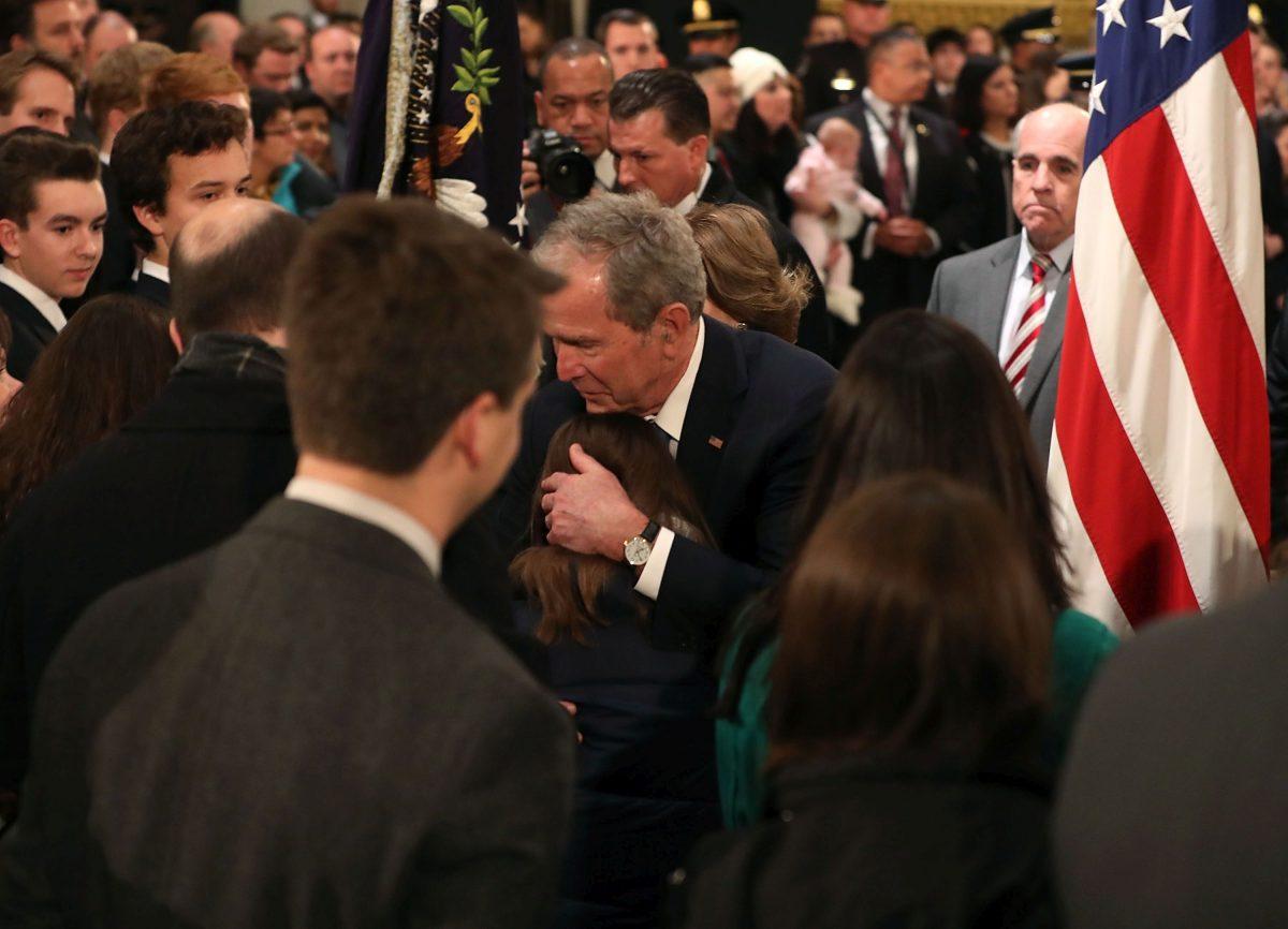 Former U.S. President George W. Bush greets mourners in front of the casket of the late former President George H.W. Bush (Photo by Mark Wilson/Getty Images)