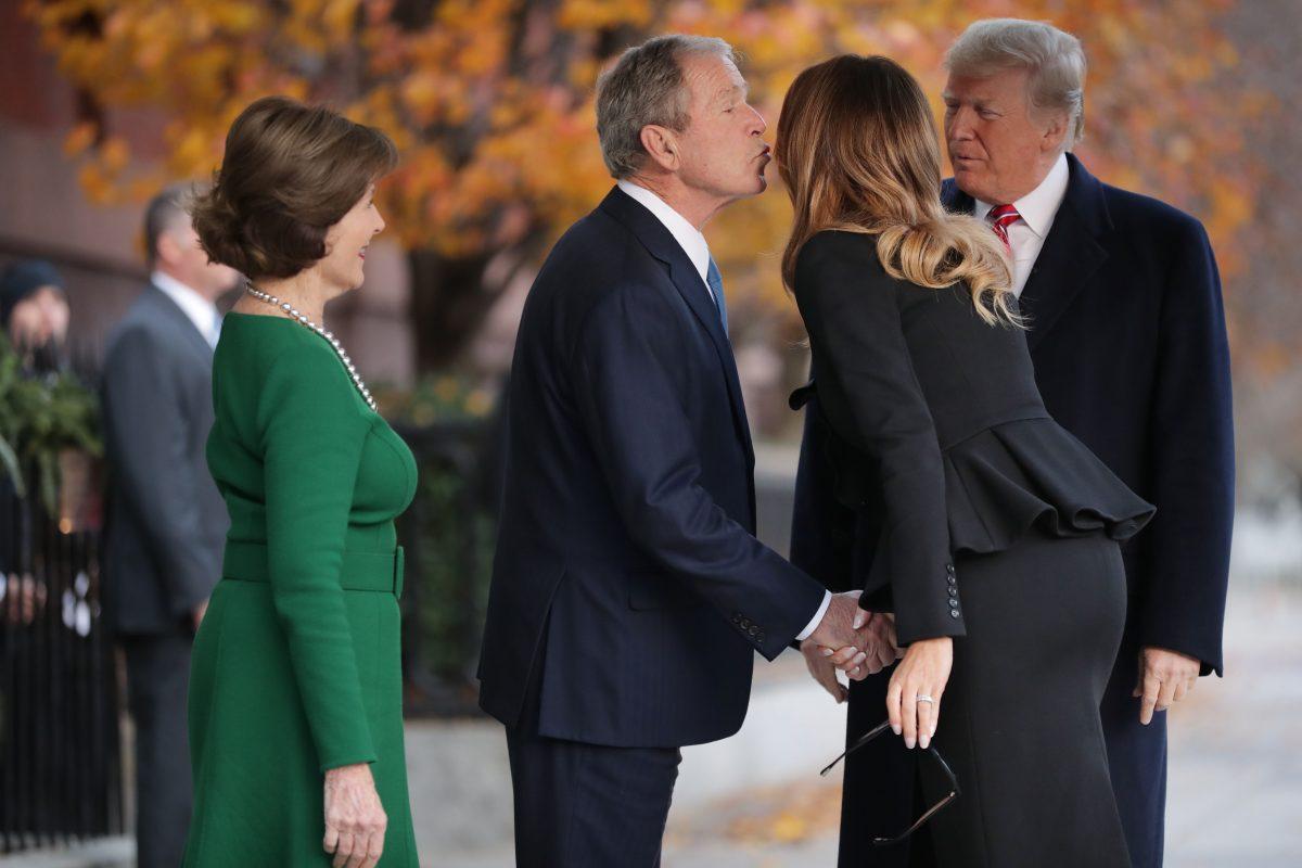 Former first lady Laura Bush and former President George W. Bush greet first lady Melania Trump and President Donald Trump outside of Blair House December 04, 2018 in Washington, DC. The Trumps were paying a condolence visit to the Bush family who are in Washington for former President George H.W. Bush’s state funeral and related honors. (Photo by Chip Somodevilla/Getty Images)