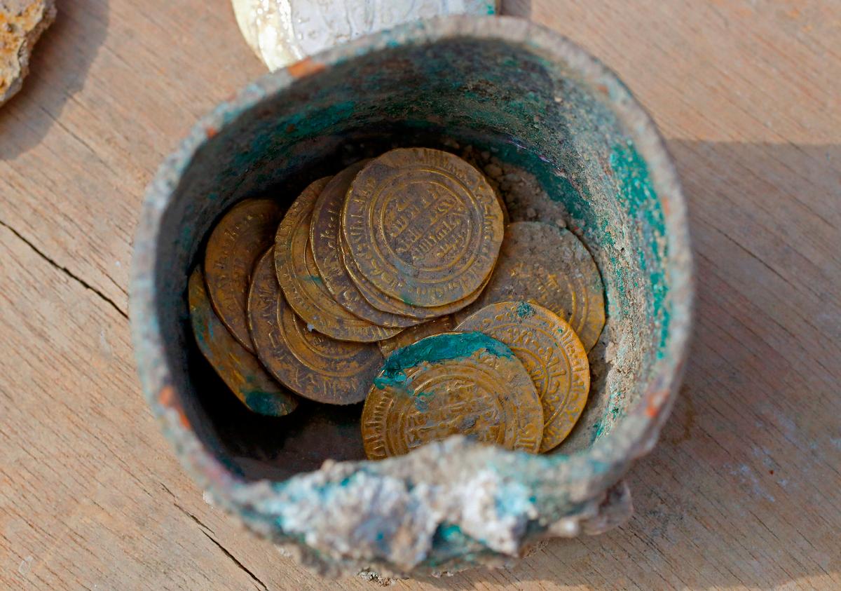 A picture taken on December 3, 2018, shows ancient gold coins recently uncovered at an excavation site in the Israeli Mediterranean town of Caesarea. (JACK GUEZ/AFP/Getty Images)