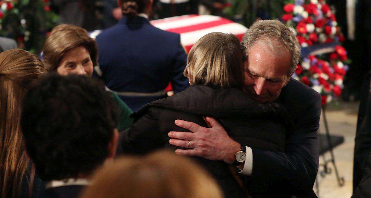 Former U.S. President George W. Bush and his wife Laura Bush greet mourners in front of the casket of the late former President George H.W. Bush as he lies in state in the U.S. Capitol Rotunda, December 4, 2018 (Photo by Mark Wilson/Getty Images)