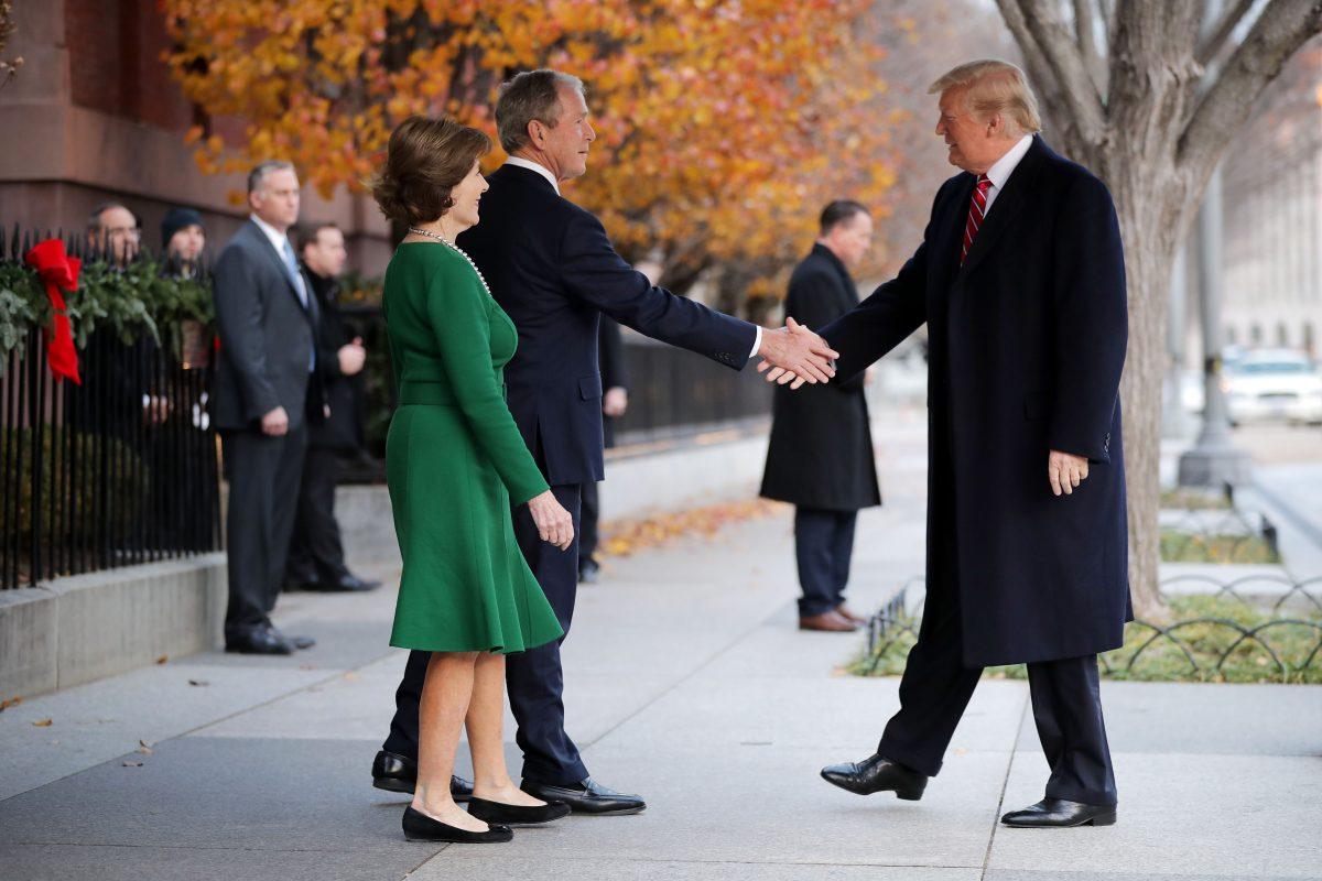 Former First Lady Laura Bush and former President George W. Bush greet President Donald Trump outside of Blair House Dec. 4, 2018, in Washington. The Trumps were paying a condolence visit to the Bush family, who are in Washington for former President George H.W. Bush’s state funeral. (Photo by Chip Somodevilla/Getty Images)