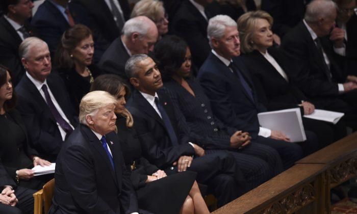 President Trump Shakes Former President Obama’s and First Lady’s Hand During Funeral