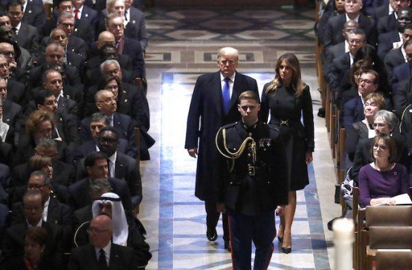 President Donald Trump and First Lady Melania Trump arrive for the State Funeral former President George H.W. Bush, at the National Cathedral in Washington, on Dec. 5, 2018. (AP Photo/Evan Vucci)