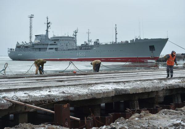 The Ukrainian command ship Donbass is seen moored as workers build a new terminal at the Port of Mariupol on the Azov Sea, eastern Ukraine, on Dec. 2, 2018. (Kenya Savilov/AFP/Getty Images)