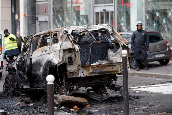 A burned car is seen on the Friedland avenue following a fourth week of protests against rising fuel prices on Dec. 9, 2018 in Paris, France. (Chesnot/Getty Images)