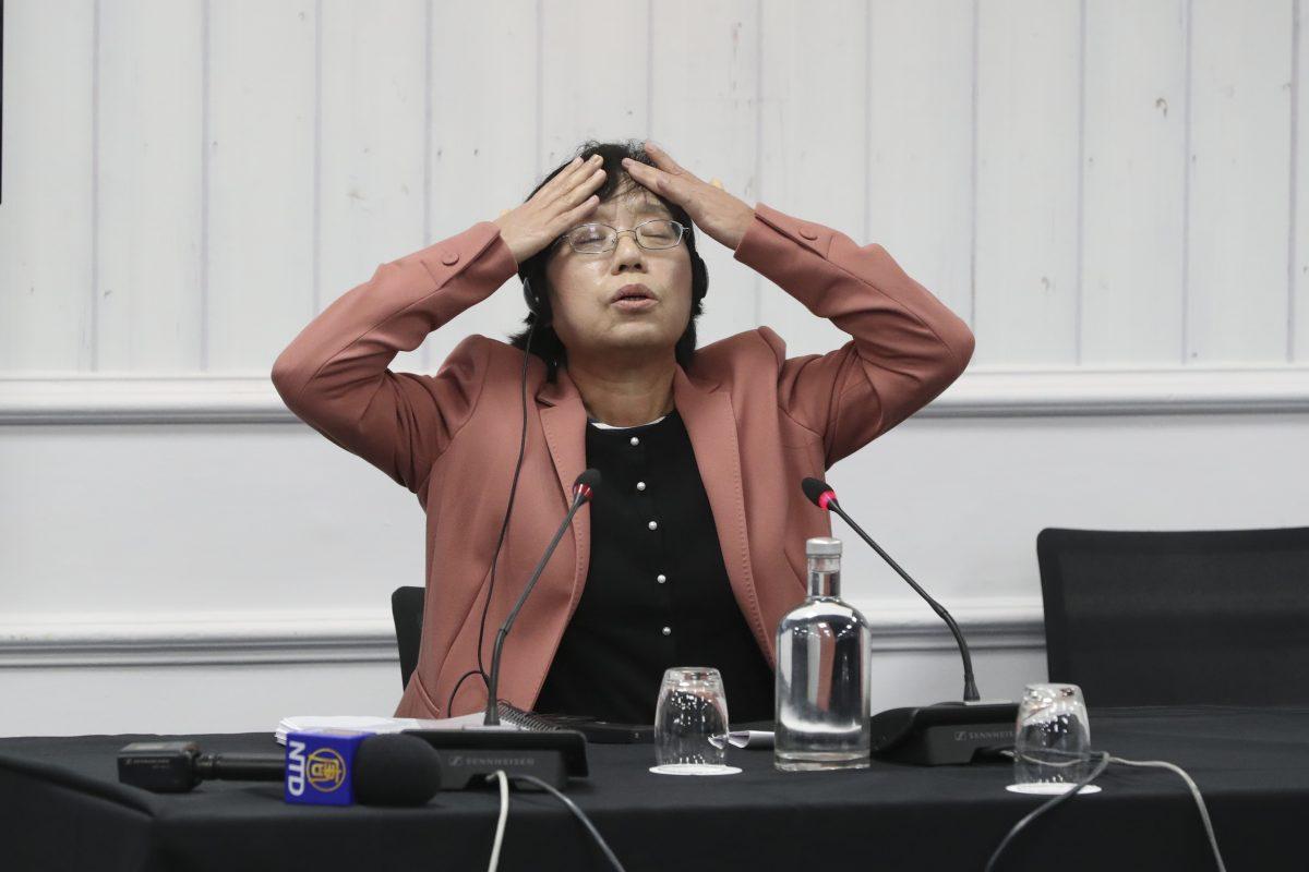 Witness Dai Ying recounts at the peoples' tribunal how she was tortured, in London on Dec. 8, 2018. (Justin Palmer)
