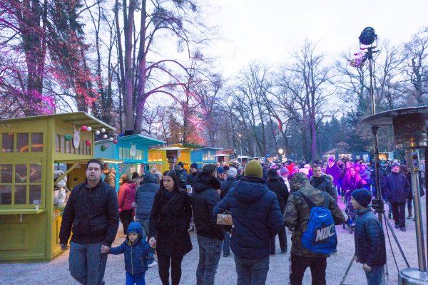 Lights and colorful kiosks are set among the trees at Maksimir Park. (Crystal Shi/The Epoch Times)