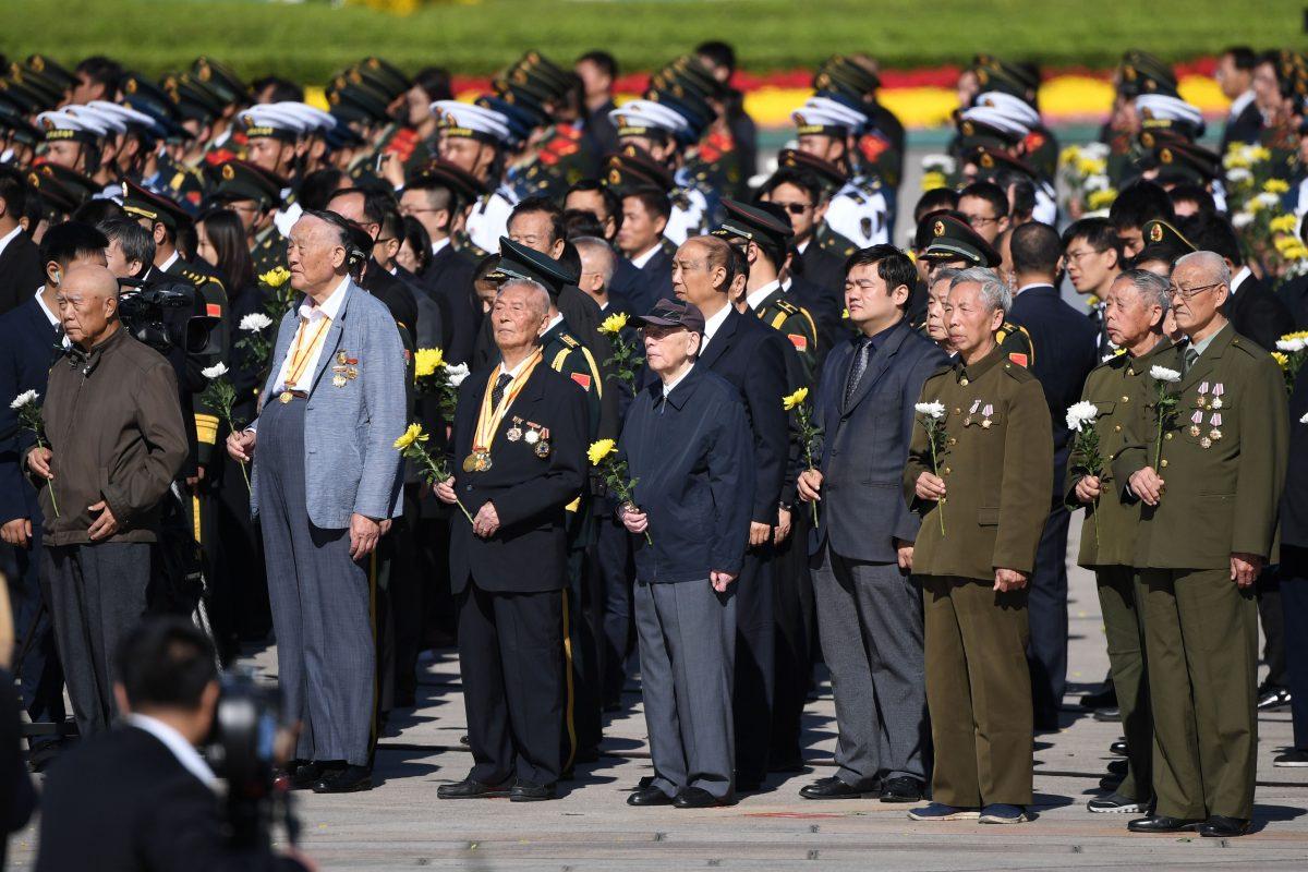 Veterans stand during a ceremony on the eve of National Day in Tiananmen Square, Beijing, on Sept. 30, 2018. (Greg Baker/AFP/Getty Images)