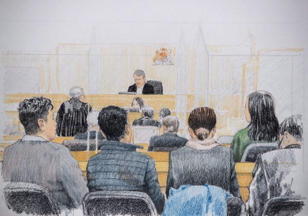 In this courtroom sketch, Meng Wanzhou, back right, the CFO of Huawei Technologies, listens during a bail hearing at B.C. Supreme Court in Vancouver, on Tuesday Dec. 11, 2018. Her husband Liu Xiaozong is seen seated at front left. (The Canadian Press/Jane Wolsak)