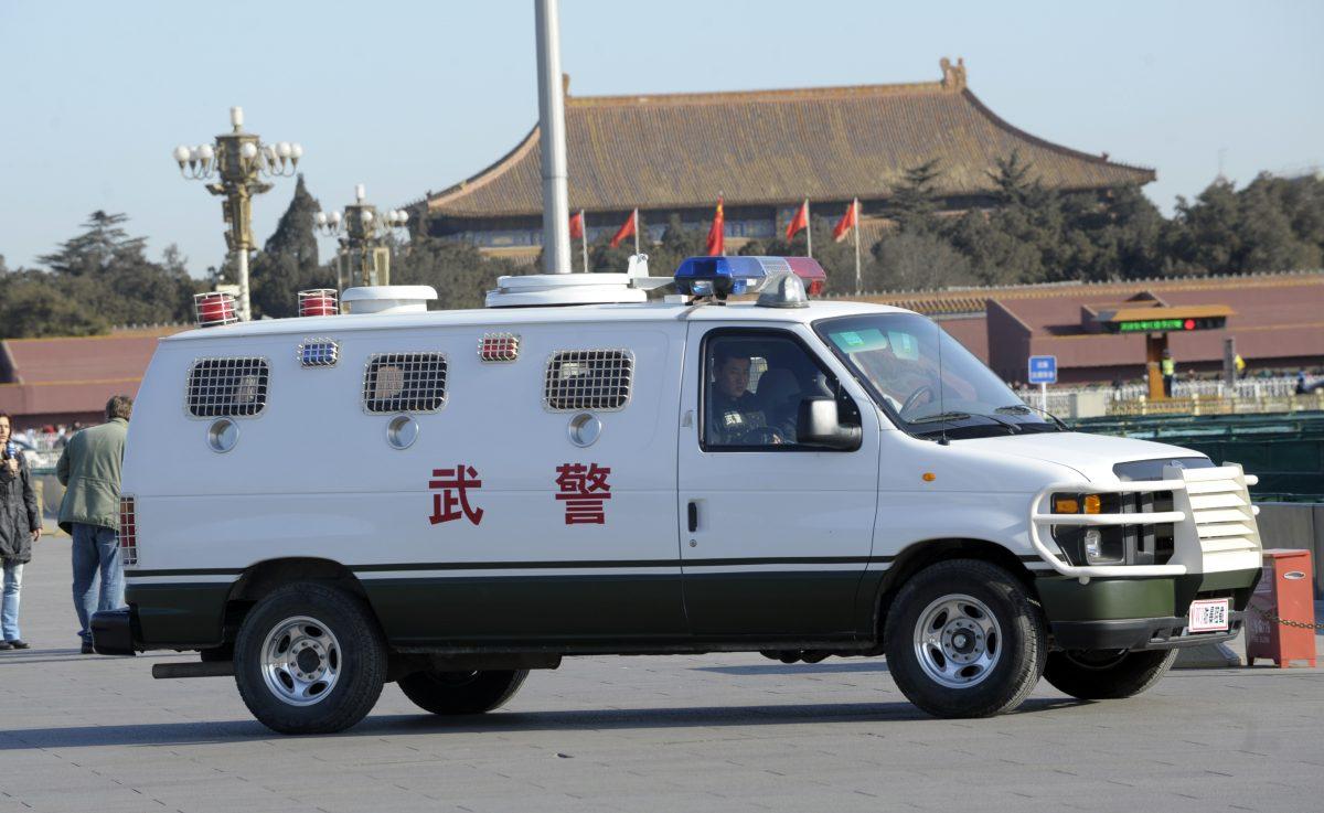 A Chinese police SWAT team vehicle parked on Tiananmen Square in Beijing on March 14, 2012. (GOH CHAI HIN/AFP/GettyImages)