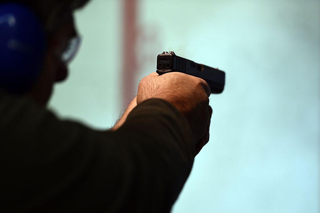 A retired police officer fires a gun at the Ultimate Defense Firing Range and Training Center in St Peters, Missouri, in a Nov. 26, 2014 file photo. (Jewel Samad/AFP/Getty Images)