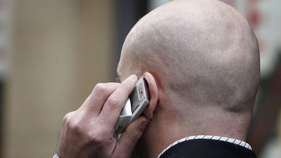 An unidentified man uses his cellphone in a file photo. (Christopher Furlong/Getty Images)