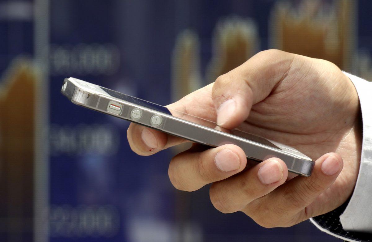 A man uses a smartphone in an undated file photo. (Shizuo Kambayashi/AP)