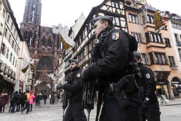French police officers patrol next to Notre-Dame cathedral of Strasbourg following a shooting in the city of Strasbourg, eastern France, on Dec. 12, 2018. (AP Photo/Jean Francois Badias)