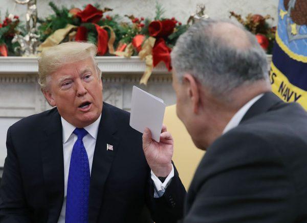 President Donald Trump argues about border security with Senate Minority Leader Chuck Schumer (D–N.Y.) in the Oval Office in Washington on Dec. 11, 2018. (Mark Wilson/Getty Images)