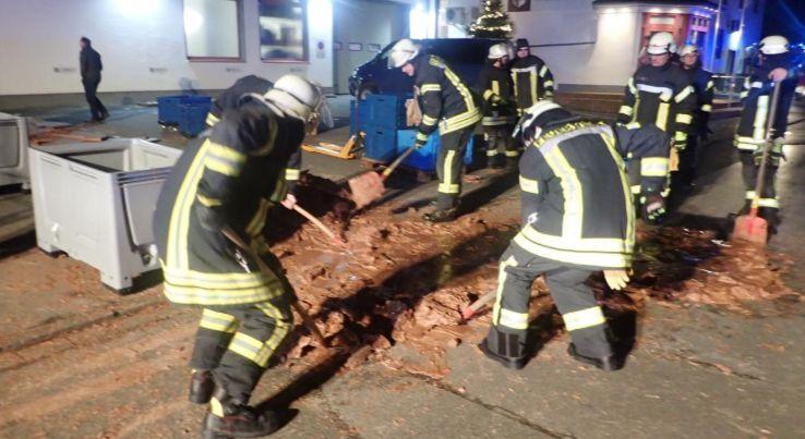 About one ton of liquid chocolate trickled out of a nearby factory tank in Westonnen, a suburb of Werl Germany, coating the pavement before solidifying, on Dec. 10, 2018, in this picture obtained from social media. (Werl Fire Department/via Reuters)