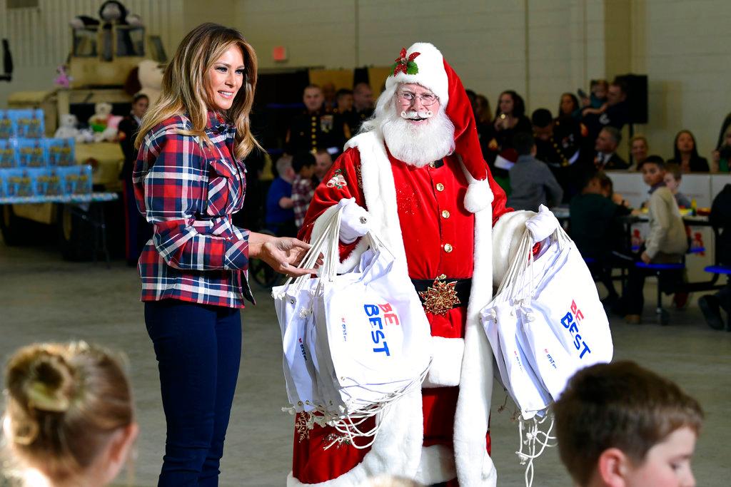 First Lady Melania Trump speaks as she stands next to Santa during a Toys for Tots event at Joint Base Anacostia-Bolling in Washington on Dec. 11, 2018. (Susan Walsh/AP Photo)