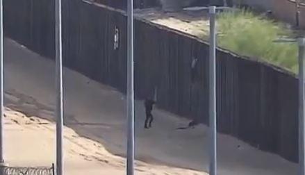 Video footage captured a girl falling off the 18-foot border wall near Yuma, Arizona on Dec. 10, 2018. (U.S. Customs and Border Protection)